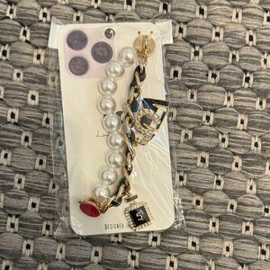 Pearl and Gold Charm Bracelet with Black and Red Accents